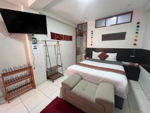 Uma cama ou camas num quarto em Cusco Rooms