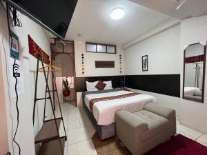 Uma cama ou camas num quarto em Cusco Rooms