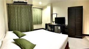 Postel nebo postele na pokoji v ubytování T.P. Place Hotel