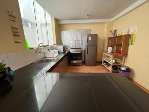 A cozinha ou kitchenette de Cusco Rooms