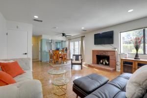 a living room with a couch and a fireplace at Modern Sacramento Townhome with Patio! in Sacramento