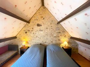 a attic room with two beds and two lamps at Coquelicots Dordogne in Saint-Julien-de-Lampon +38 photos