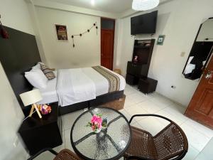 Uma cama ou camas num quarto em Cusco Rooms