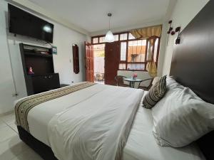 Uma cama ou camas num quarto em Cusco Rooms