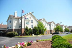 a building with an american flag on a street at Homewood Suites by Hilton Saint Louis-Chesterfield in Chesterfield
