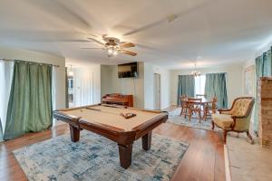 a living room with a pool table in it at Lovely Goldsboro Home with Yard and Grill! in Goldsboro