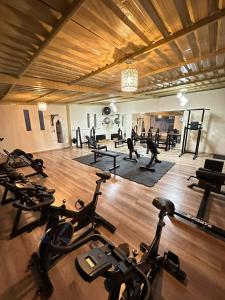 a gym with a bunch of exercise bikes in it at Jardines Ambato in Ambato