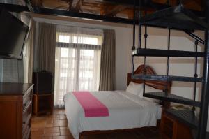 Postel nebo postele na pokoji v ubytování Hotel Meson del Mar