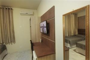TV a/nebo společenská místnost v ubytování Hotel Real