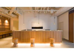 a large room with a stage and stools at GRIDS Premium Hotel Otaru - Vacation STAY 68534v in Otaru