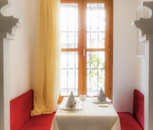 Uma área de estar em Hotel Blanco Riad