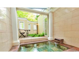 a house with a pool in the middle of a room at Restaurant & Hotel Traumerei - Vacation STAY 47795v in Hakuba