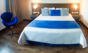 Postel nebo postele na pokoji v ubytování Hotel Royal Elim International
