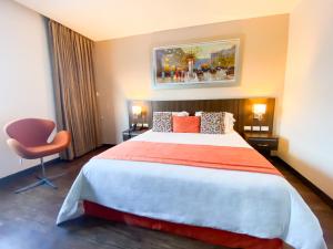Postel nebo postele na pokoji v ubytování Hotel Royal Elim International