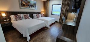 Postel nebo postele na pokoji v ubytování Hotel Royal Elim International