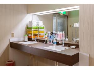 a bathroom with two sinks and a large mirror at Business Hotel Katsuya - Vacation STAY 62197v in Wakayama