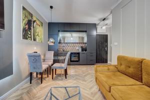 a living room with a couch and a table at NOVA L-Elite in Szczecin