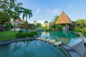a swimming pool at a resort at Lalasa Villas Canggu in Canggu