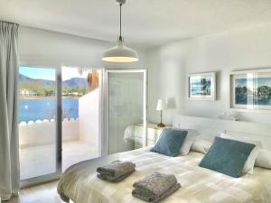 a bedroom with a large bed with two pillows on it at CASA PRINCESA in Alcudia
