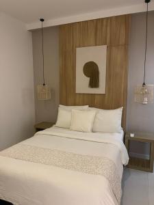 Ένα ή περισσότερα κρεβάτια σε δωμάτιο στο Moet Medellin Hotel