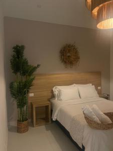 Ένα ή περισσότερα κρεβάτια σε δωμάτιο στο Moet Medellin Hotel