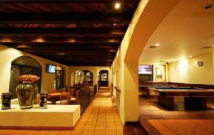 a lobby with a pool table and a vase on a table at Club Maeva Miramar Tampico in Ciudad Madero