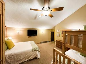 a bedroom with two beds and a ceiling fan at Premium Ski In Ski Out At Giants Steps Chairlift! in Brian Head +42 photos