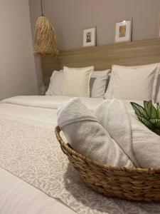 Ένα ή περισσότερα κρεβάτια σε δωμάτιο στο Moet Medellin Hotel