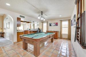 a living room with a pool table in it at Family-Friendly Peoria Home with Pool and Fire Pit! in Peoria