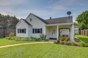 a white house with a yard at Private Plainfield Retreat with Gas Grill and Patio in Plainfield