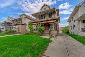 a house with a lawn in front of it at Renovated Main Floor Large 3 Bed House in Buffalo