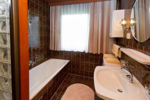 Kúpeľňa v ubytovaní Ferienhaus Birkenweg + 28 fotografií