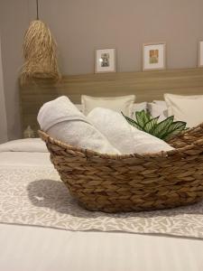 Ένα ή περισσότερα κρεβάτια σε δωμάτιο στο Moet Medellin Hotel
