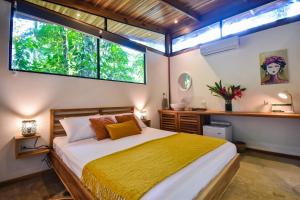 Voodi või voodid majutusasutuse Satta Lodge toas