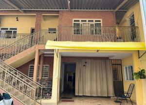 a house with two balconies on top of it at Pousada Lopes na Fama in Goiânia