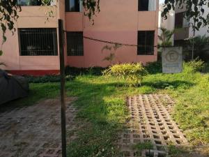 a brick path in front of a building at Departamento Completo Zona residencial la Molina in Lima