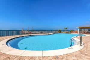 a large swimming pool with blue water at Harbour Pointe 609 in Perdido Key