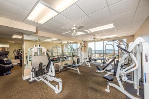 a fitness room with treadmills and tread machines at Harbour Pointe 609 in Perdido Key