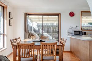 a kitchen and dining room with a table and chairs at Solander's Retro Residence - By the Beach Group Stay in Dromana +11 photos