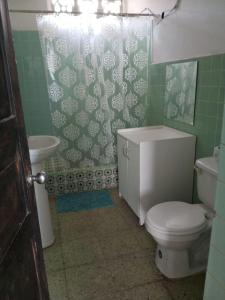 a bathroom with a toilet and a sink at Departamento frente al mar in Playas