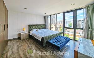 a bedroom with a bed and a large window at W8 Condo 2Bedroom Luxury Private floor Penthouse in Central BKK in Bangkok
