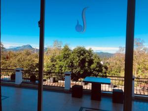 a view of a balcony with a blue table at Elegant Hotel in Kandy