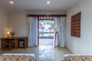 Ένα ή περισσότερα κρεβάτια σε δωμάτιο στο Nalika Beach Resort - Adults Only
