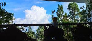 a view of the sky from a balcony at Mansarover Home Stay in Kalimpong