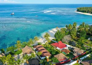 an aerial view of a beach with houses and the ocean at Katiet Beach Resort Mentawai Lances Right HTS in Katiet