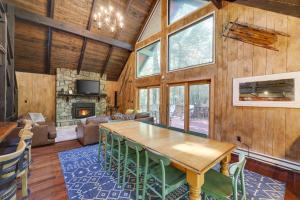 a living room with a wooden table and a fireplace at ⛰⛵️⛱Mt. Maplewood Lodge❤️Seasonal Specials ☆Poconos☆Cabin☆Hot⛷Tub☆Game Room☆ in Pocono Pines