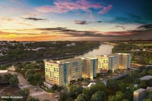 an aerial view of a city with a river and buildings at Riverview Two Bedroom Condo at One Spatial Iloilo in Iloilo City