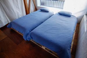 Postel nebo postele na pokoji v ubytování ＵＧＯ + 9 fotografií