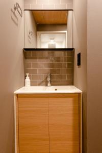 a bathroom with a sink and a mirror at THE BONDS HOTEL TOKYO in Tokyo +33 photos