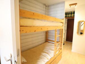 a bunk bed in the hallway of a house at Studio Les Gets, 1 pièce, 4 personnes - FR-1-623-214 in Les Gets